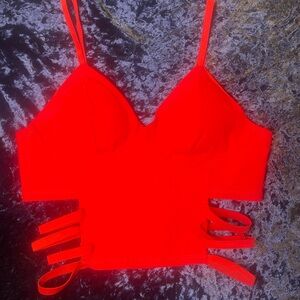 New Large red crop top with elastic on the sides. Never worn. Very sexy. NWOT